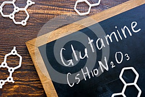 Glutamine amino acid formula on the blackboard.