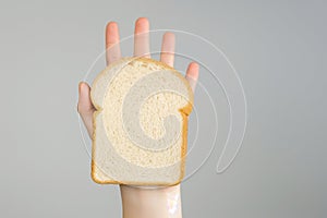 Gluten allergy, hand holding bread slice, refusing to eat, Gluten intolerant and Gluten free diet concept