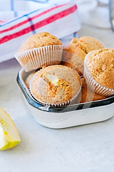 Gluten free almond flour muffins with apples in a bowl on a whit