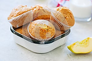 Gluten free almond flour muffins with apples in a bowl on a whit