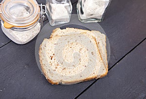 Gluten free bread with spelled flower on wooden background