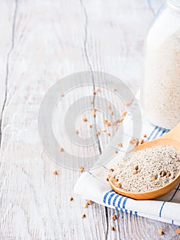 Gluten free buckwheat flour on wooden background