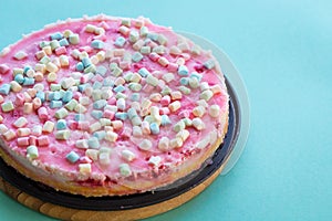 Gluten-free Cheesecake with Marshmallows for Party on Light Blue Background, Horizontal View