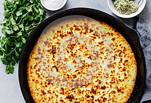 Gluten free flatbread with roasted chickpeas, cauliflower and avocado dip on a light background, top view.