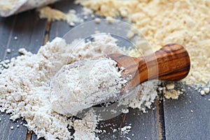 Gluten free oat flour in wooden scoop