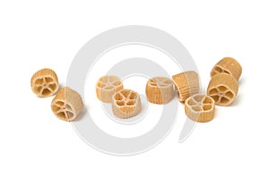 gluten free pasta in shaped wheel on white background