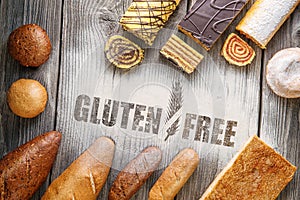 Gluten free pastries, breads and rolls on wooden background, product photography for bakery or shop with flour