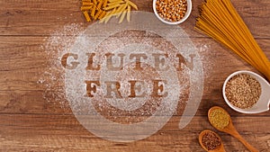 Gluten free products gathering around words written in flour