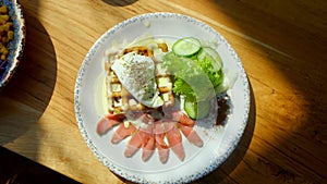 gluten-free waffle with poached egg and salmon