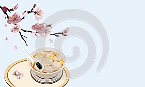 Glutinous rice balls or tang yuan with sesame insid with pink peach bloosom decoratione