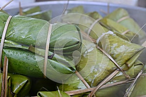 Glutinous rice steamed in banana leaf in steam pot