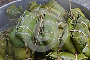 Glutinous rice steamed in banana leaf in steam pot