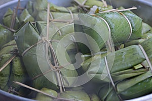 Glutinous rice steamed in banana leaf in steam pot