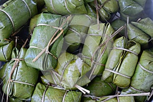 Glutinous rice steamed in banana leaf in steam pot