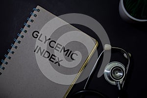 Glycemic Index write on a book isolated on Office Desk. Healthcare or Medical Concept
