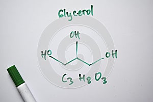 Glycerol C3,H8,O3 molecule written on the white board. Structural chemical formula. Education concept
