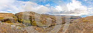 Glymur waterfall in Iceland panorama of gorge behind fall and river leading down to lake