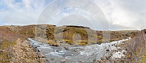 Glymur waterfall in Iceland panorama of river behind the fall during autumn