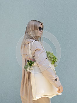 GMO-free bio food concept. Woman Holding Cotton Grocery Bag Full With Fresh Green Eco Vegetables