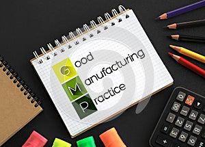 GMP - Good Manufacturing Practice acronym on notepad, business concept background