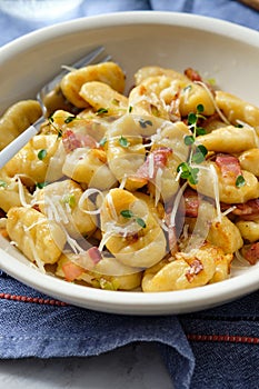 Gnocchi with bacon and asparagus beans. Italian food.