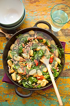 Gnocchi with bacon, spinach & tomatoes photo