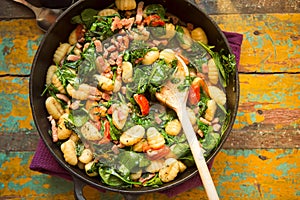 Gnocchi with bacon, spinach & tomatoes photo