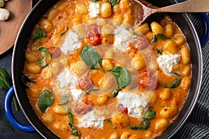 Gnocchi in creamy tomato sauce with baby spinach and melted mozzarella