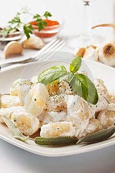 Gnocchi di patata with basilico and cheese sauce photo