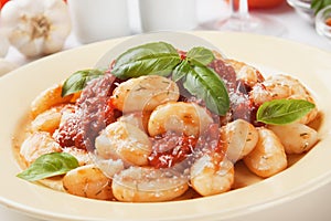 Gnocchi di patata with basilico and tomato sauce photo