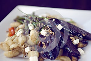 Gnocchi dish with asparagus and dark sausage