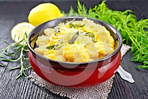 Gnocchi pumpkin with sage in bowl on dark board