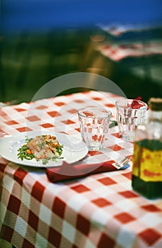 Gnocchi with tomato sauce and rocket salad with parmesan cheese