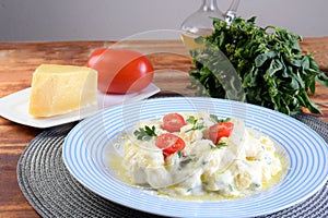 Gnocchi with white bÃ©chamel sauce, typical Italian pasta potato food