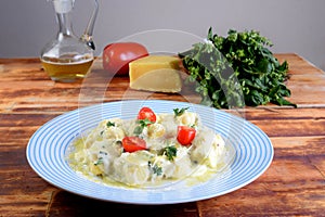 Gnocchi with white bÃ©chamel sauce, typical Italian pasta potato food