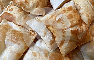 Gnocco fritto Crescentine. Traditional Italian cuisine. Substitute for bread made with fried dough photo