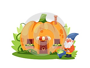 Gnome Gardener near the Fairytale Pumpkin House, Fairytale Home In Ripe Orange Gourd With Wooden Door, Windows