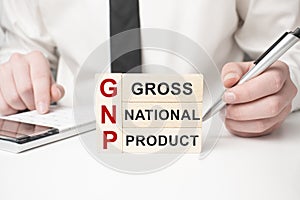 GNP Gross National Product text wooden cube blocks on table background. Idea, Strategy, advertising, marketing, Keyword and