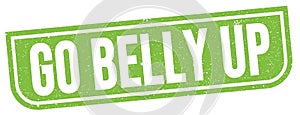 GO BELLY UP text written on green stamp sign