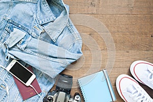 Go on board an adventure trip with camera, smart phone and more items, Flat lay on wood