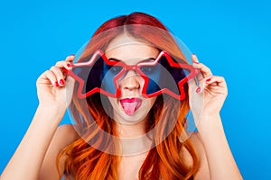 Go crazy! Young cheerful foxy with big funny star glasses and to