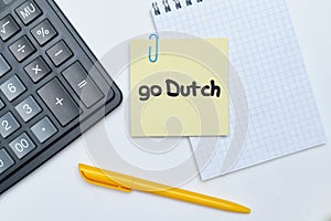 Go Dutch - english money idiom hand lettering on wooden blocks