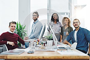 Go get that business growth. Portrait of a team of young go getters working in a modern office.