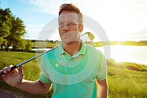 Go golfing or go home. a young man spending the day on a golf course.