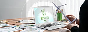 Go green for environmental awareness concept display on laptop. Trailblazing