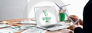 Go green for environmental awareness concept display on laptop. Trailblazing