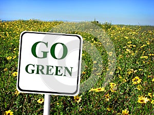 Go green sign field of flowers