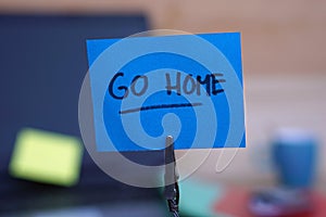 Go home written on a memo