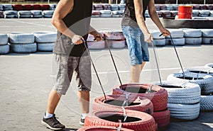 The go kart racing service workers moves wheels at the track