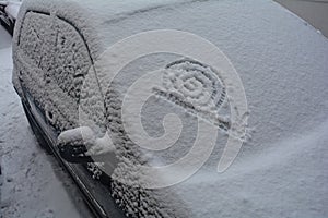 Go slowly - A snail in the snow, painted on an autodisc